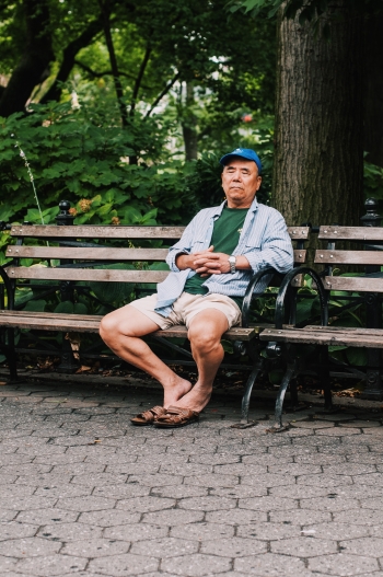 Picture of a man resting on a park bench